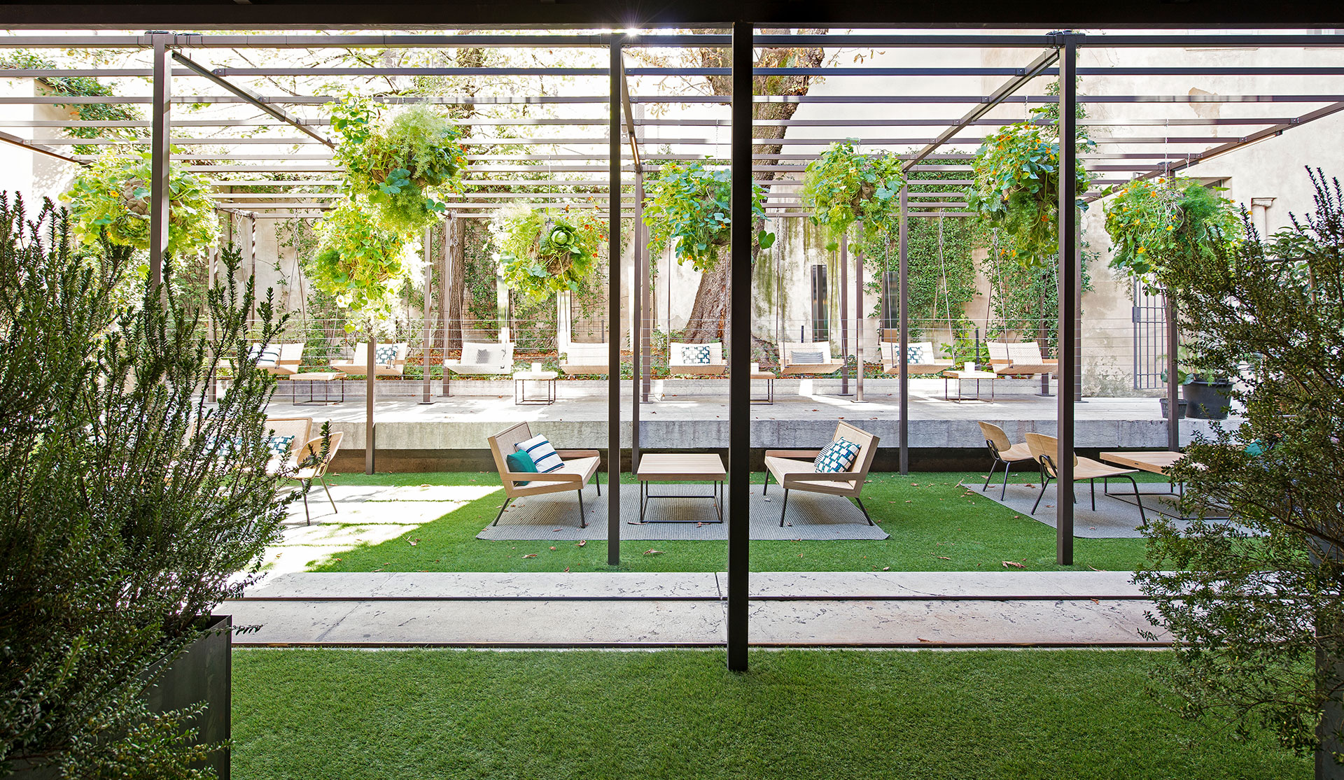 Elle Decor Grand Hotel Design Therapy: courtyard garden under a steel pergola