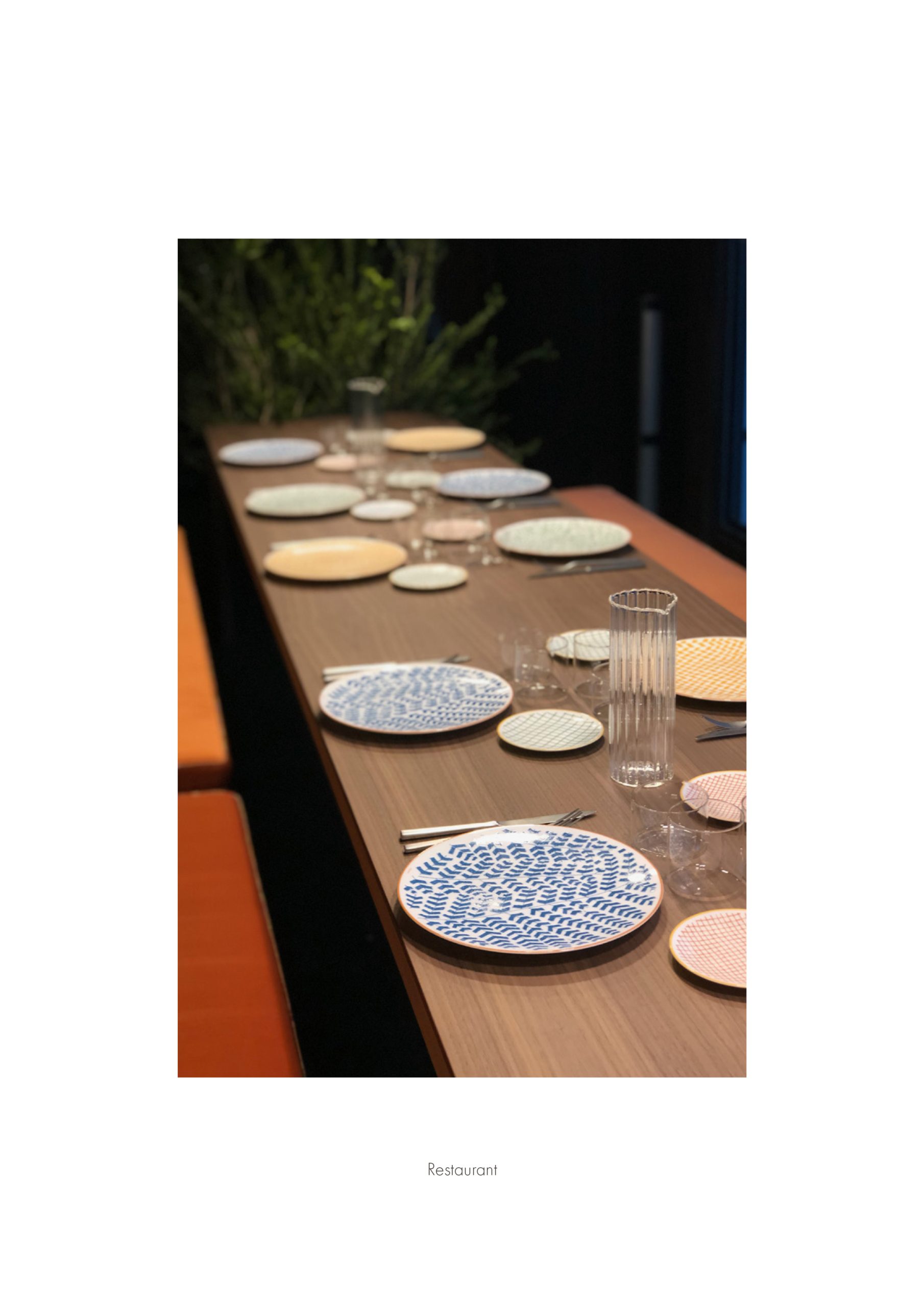 Elle Decor Grand Hotel Design Therapy: dining table set with patterned plates, from the project booklet