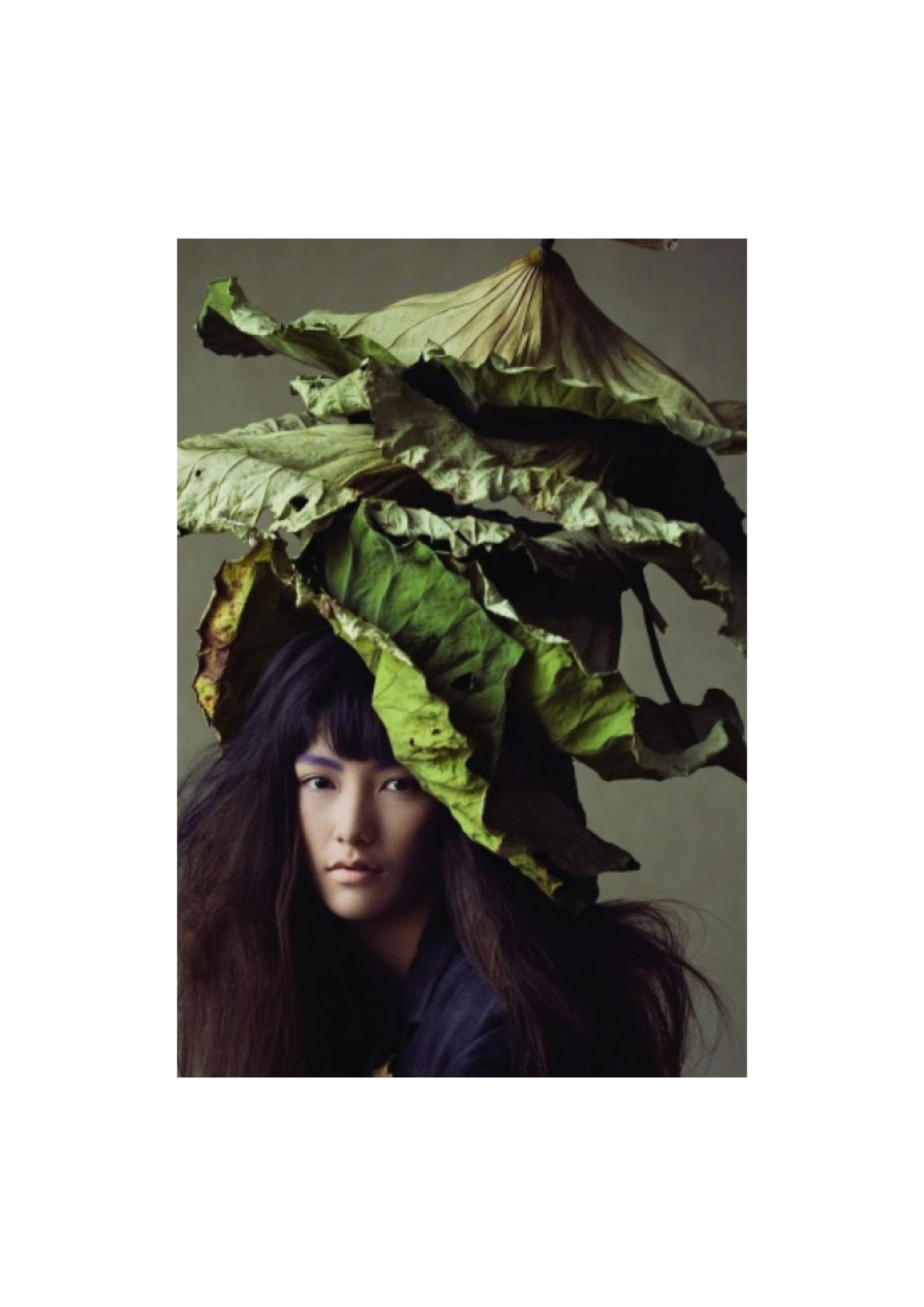 Elle Decor Grand Hotel Design Therapy: portrait of a woman crowned with large leaves, from the project booklet