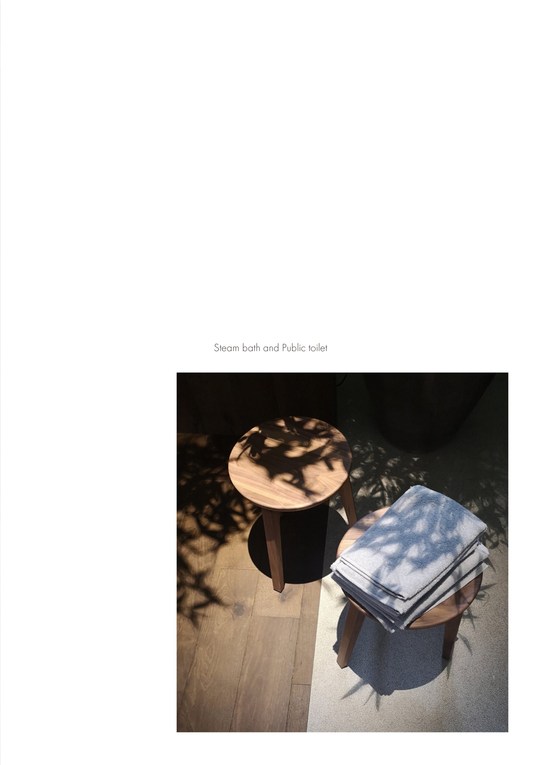 Elle Decor Grand Hotel Design Therapy: side table with folded towels in dappled light, from the project booklet