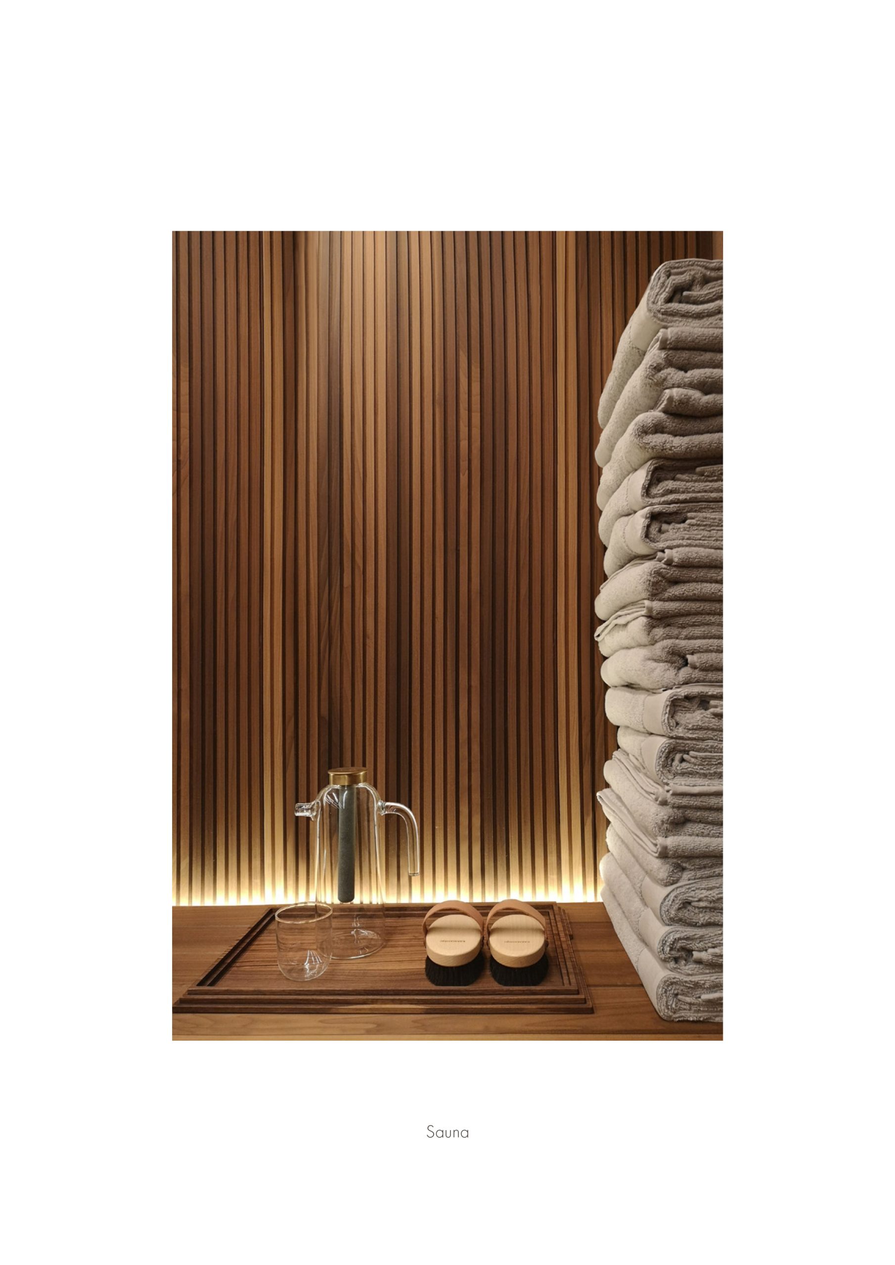 Elle Decor Grand Hotel Design Therapy: wooden sauna with stacked towels, from the project booklet