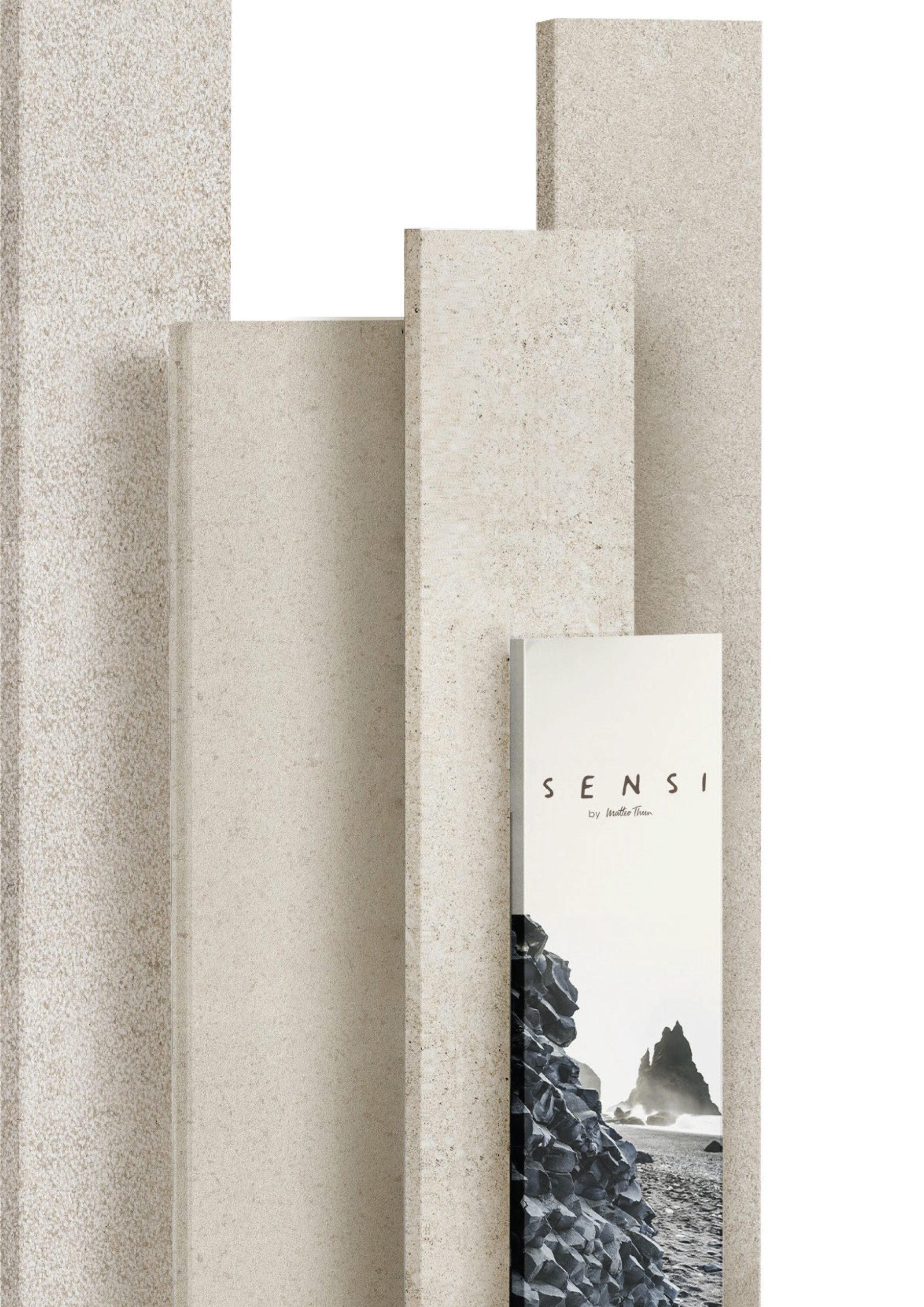 Florim Sensi porcelain stoneware slabs standing upright with the collection brochure.