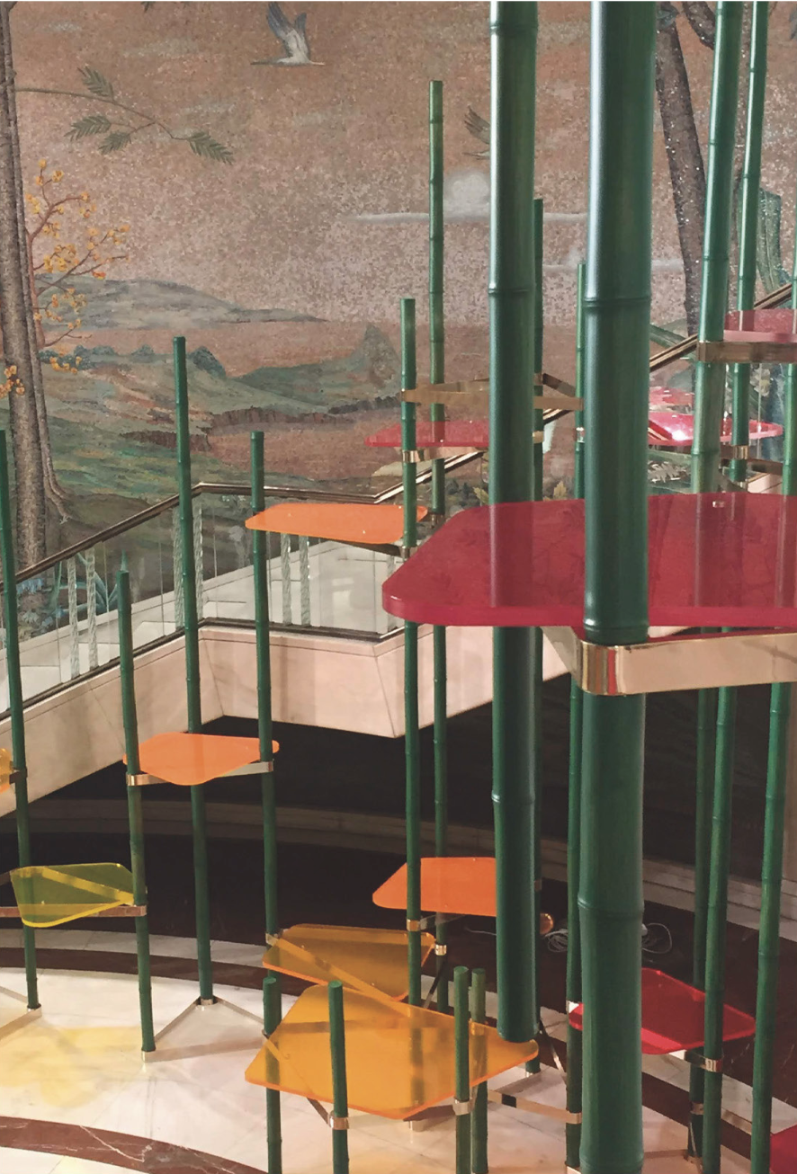 Arc de Triomphe for Zara: green poles and coloured platforms of the staircase installation