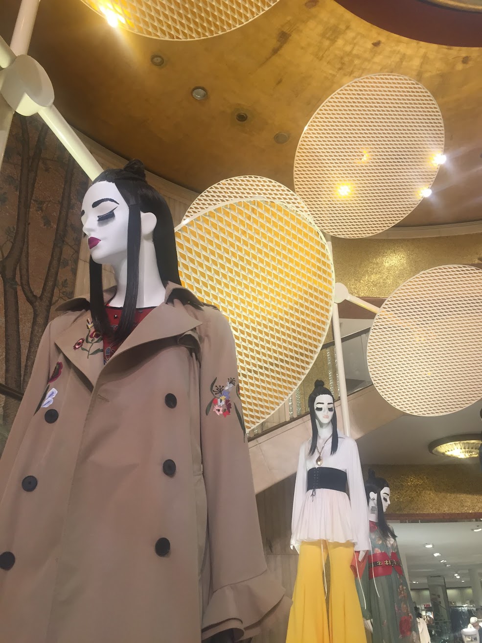 Milano Design Week installation for Zara: mannequins beneath suspended perforated discs