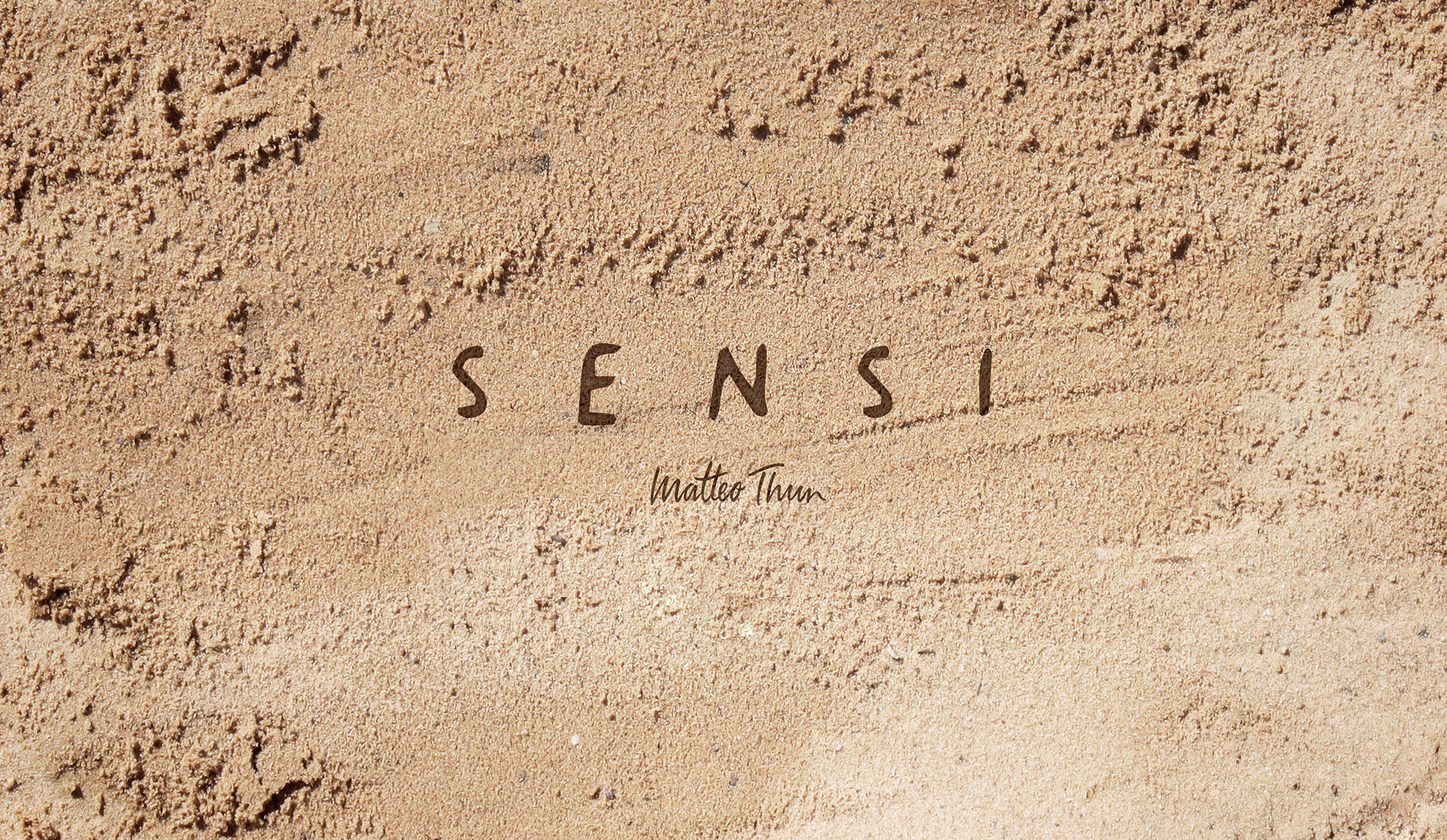 Sensi Collection by Florim: Sensi logo on a sand-textured surface