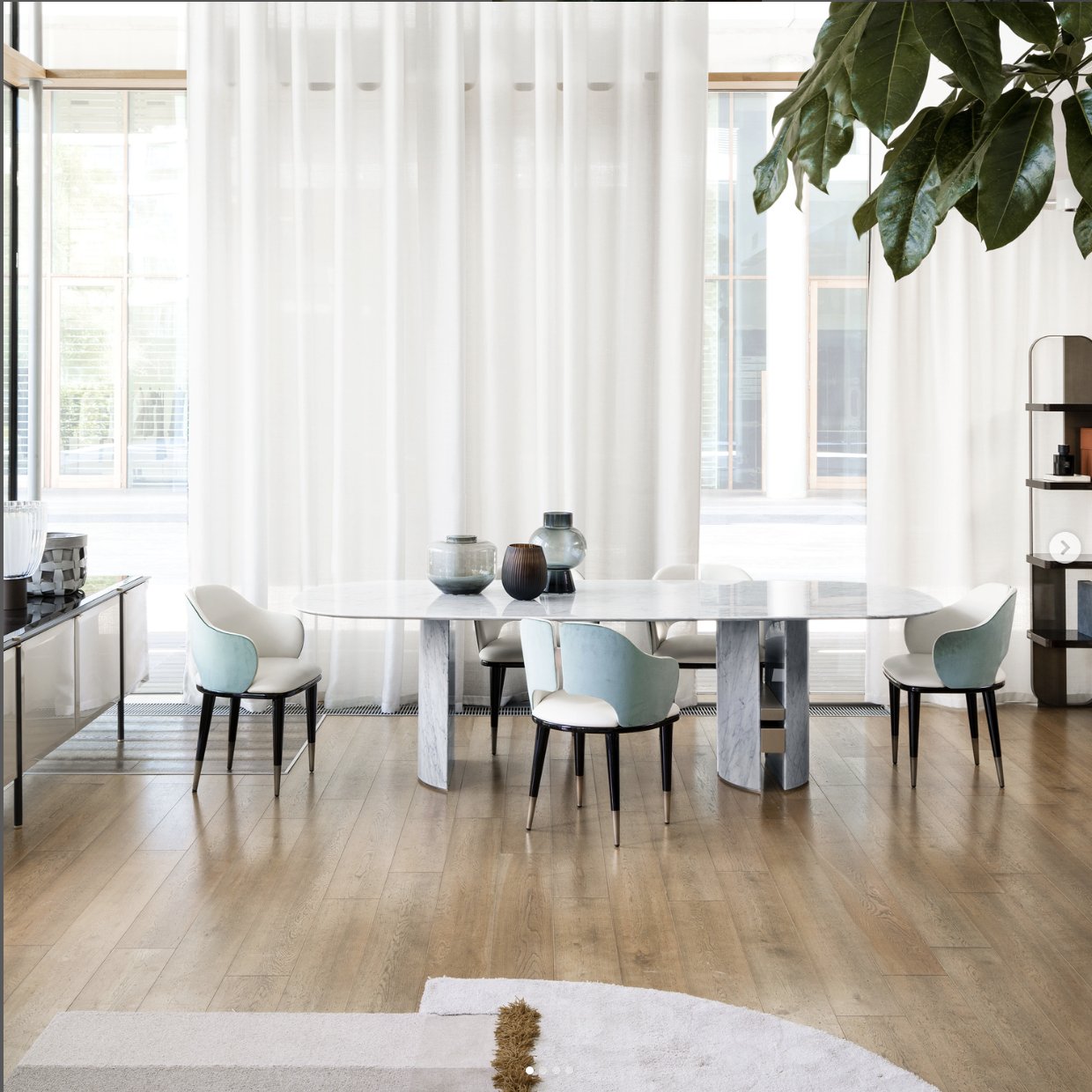 Showroom for Capital Interiors: render of a dining area with a round table and sheer curtains