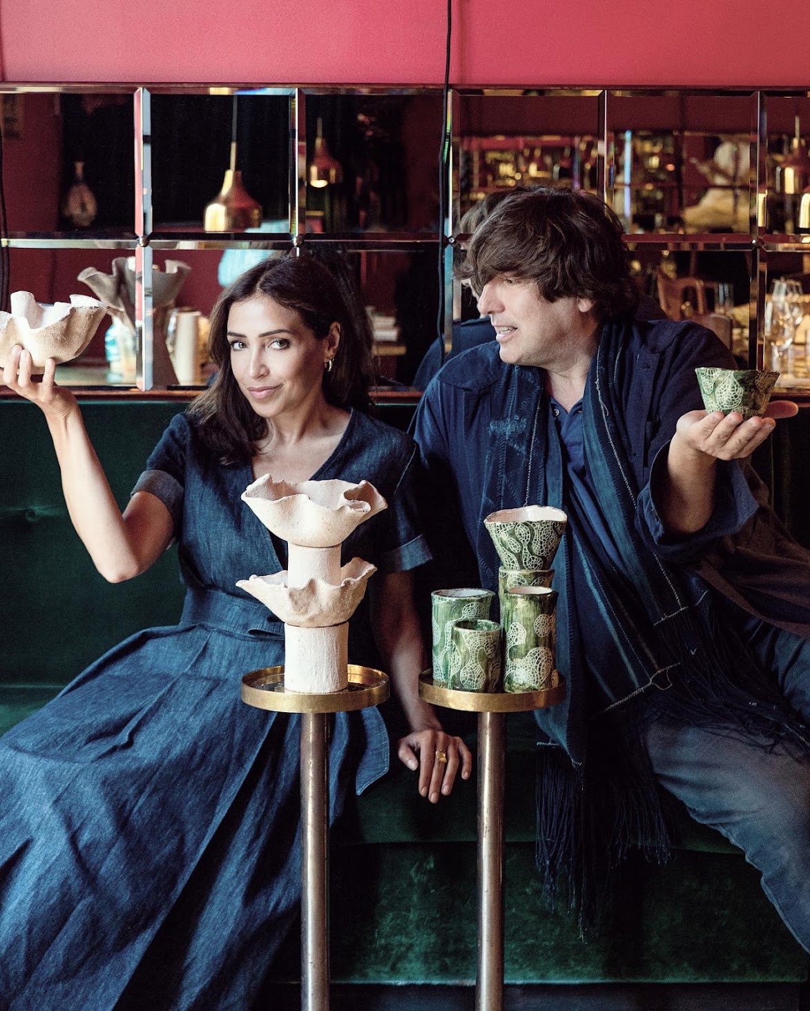 We're Made in Fornace: two people in denim holding ceramic pieces at a table