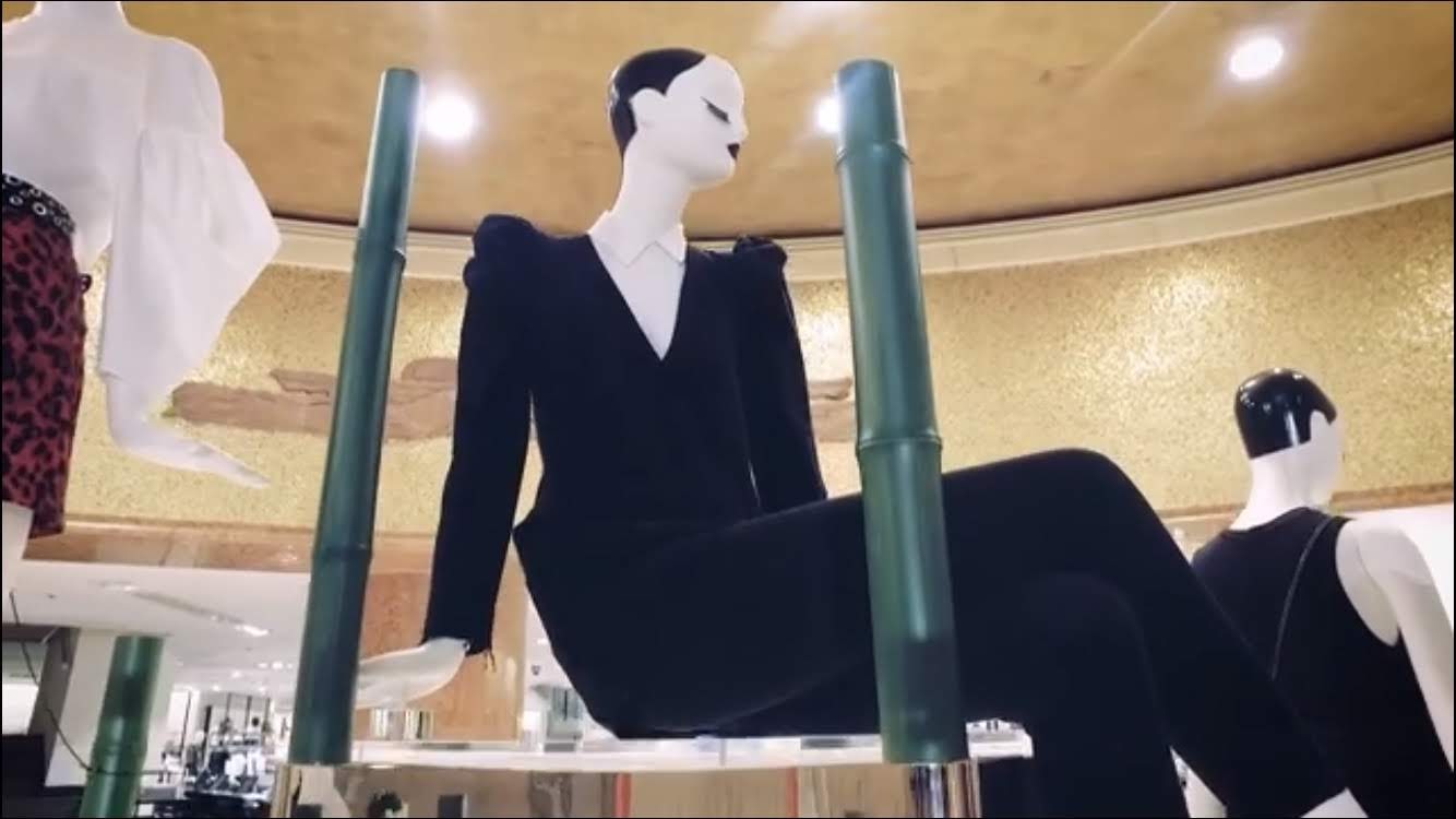 Mannequins in black tailoring under a gold ceiling, Zara “Arc de Triomphe” installation.