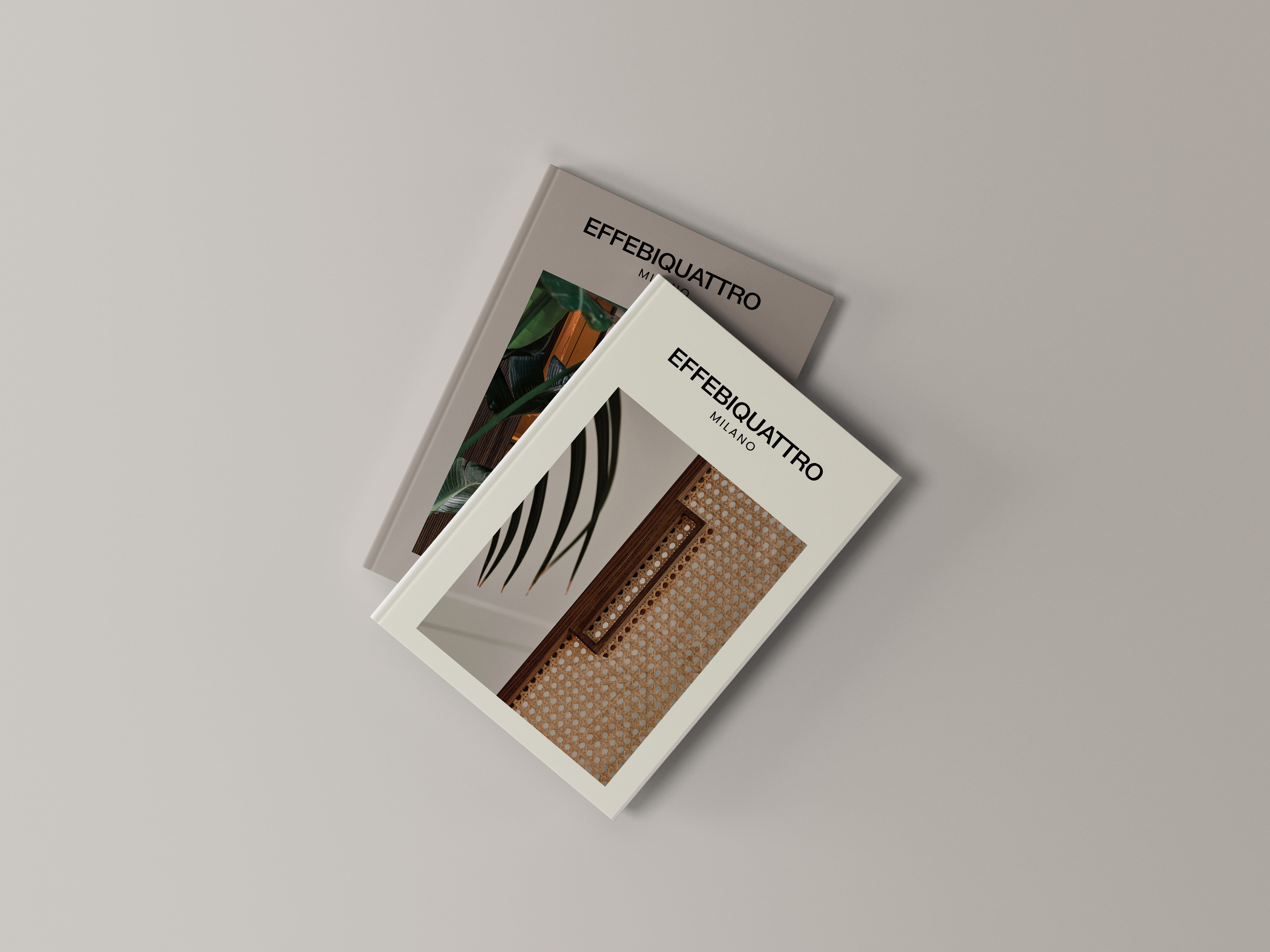 Effebiquattro Milano brand image: two printed brochures on a grey surface