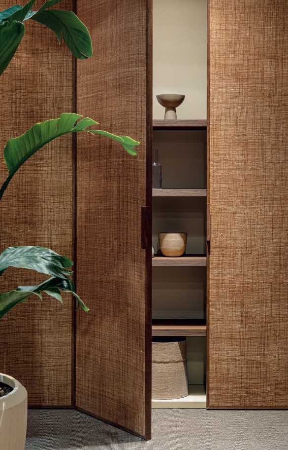 Effebiquattro Milano new art direction: wood-slatted cabinet with a plant