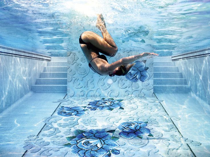 SICIS locations: swimmer diving over a blue floral mosaic pool floor