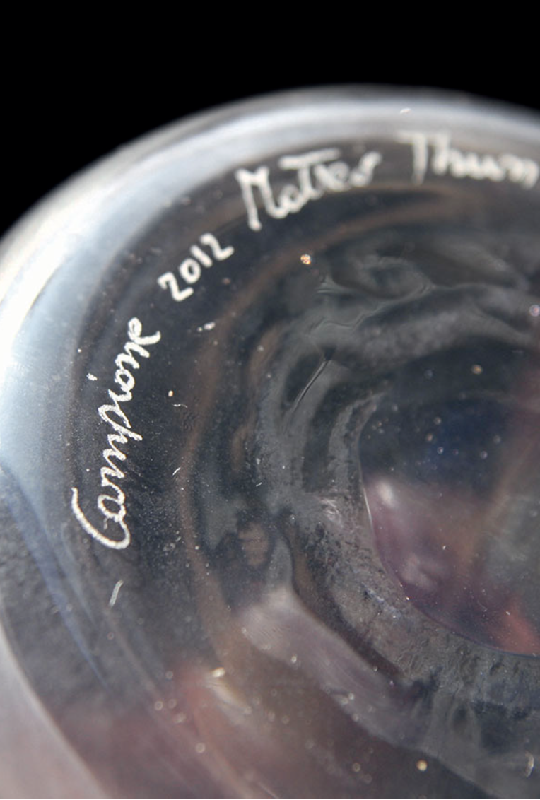 Detail of a Venini glass piece engraved with “Campione 2012” and Matteo Thun’s signature.