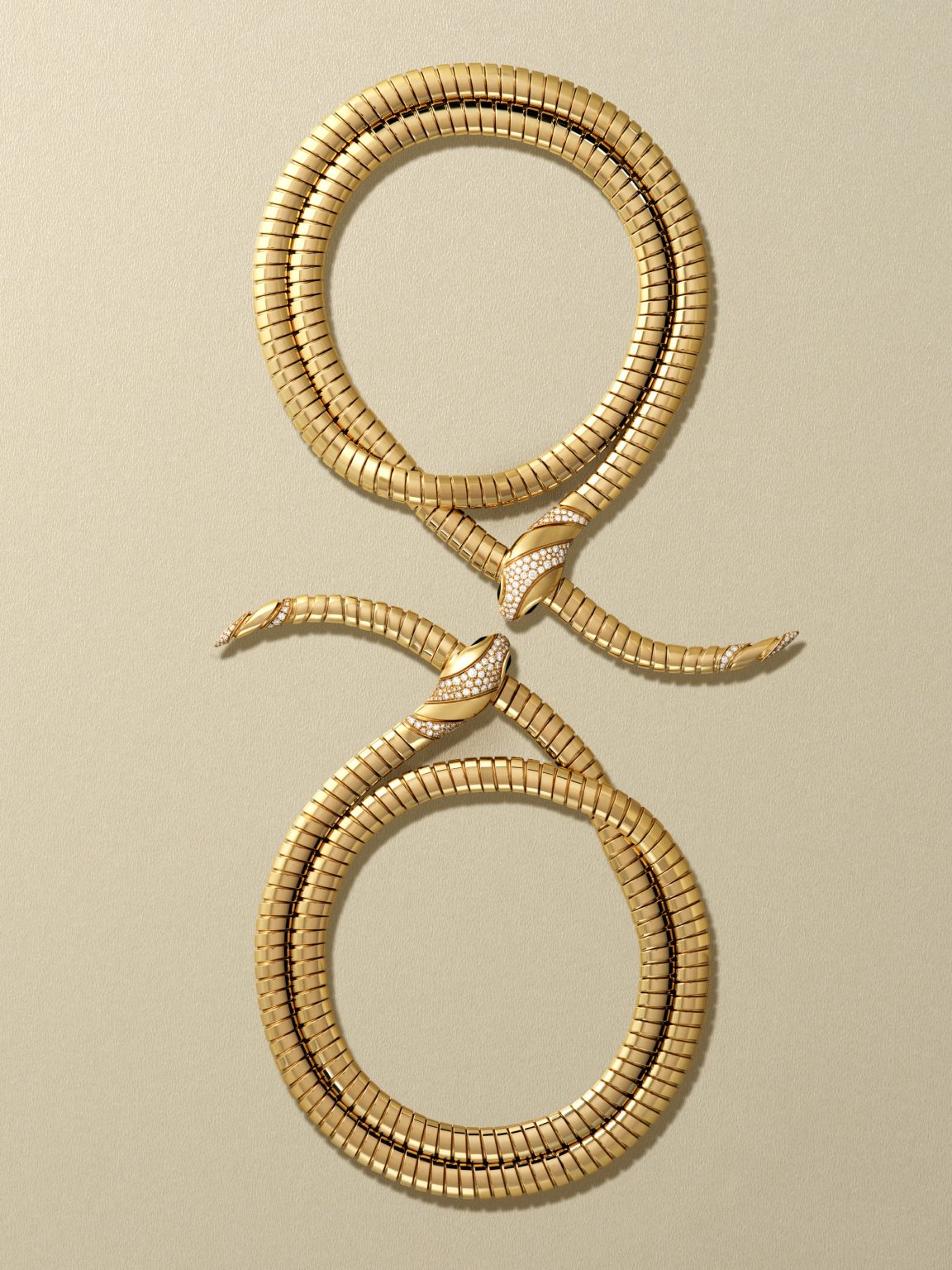 Bulgari Serpenti frames for Harper's Bazaar: Serpenti necklace shaped into two loops