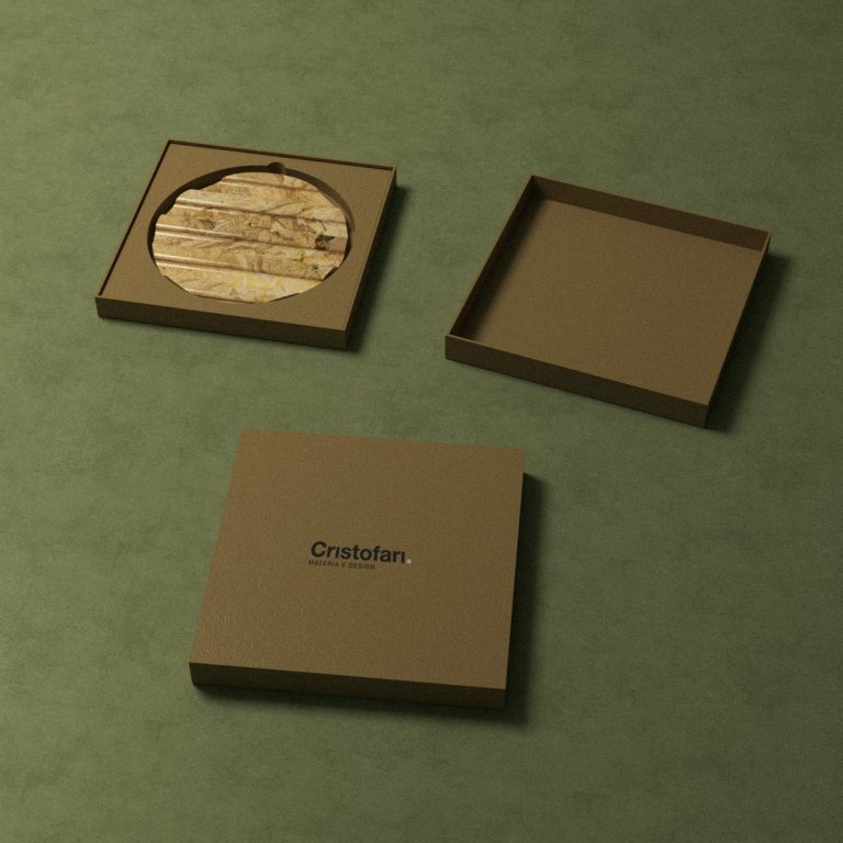 Ceramic pen holder gift set for Cristofari in kraft boxes on a green background, designed by Elena Pelosi.