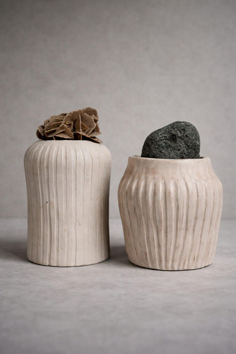 Mineral Vessels (Emergence): two ribbed ceramic vessels topped with a desert rose and a stone