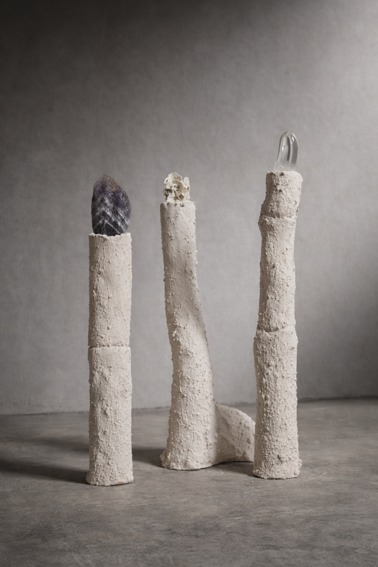 Mineral Vessels II (Emergence): three porous ceramic columns with stones and crystals
