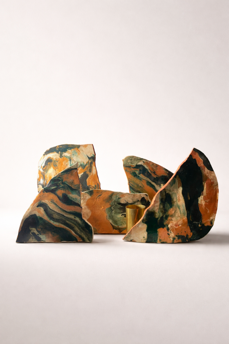 Group of OURO collection fragments in marbled terracotta, black and green clay.