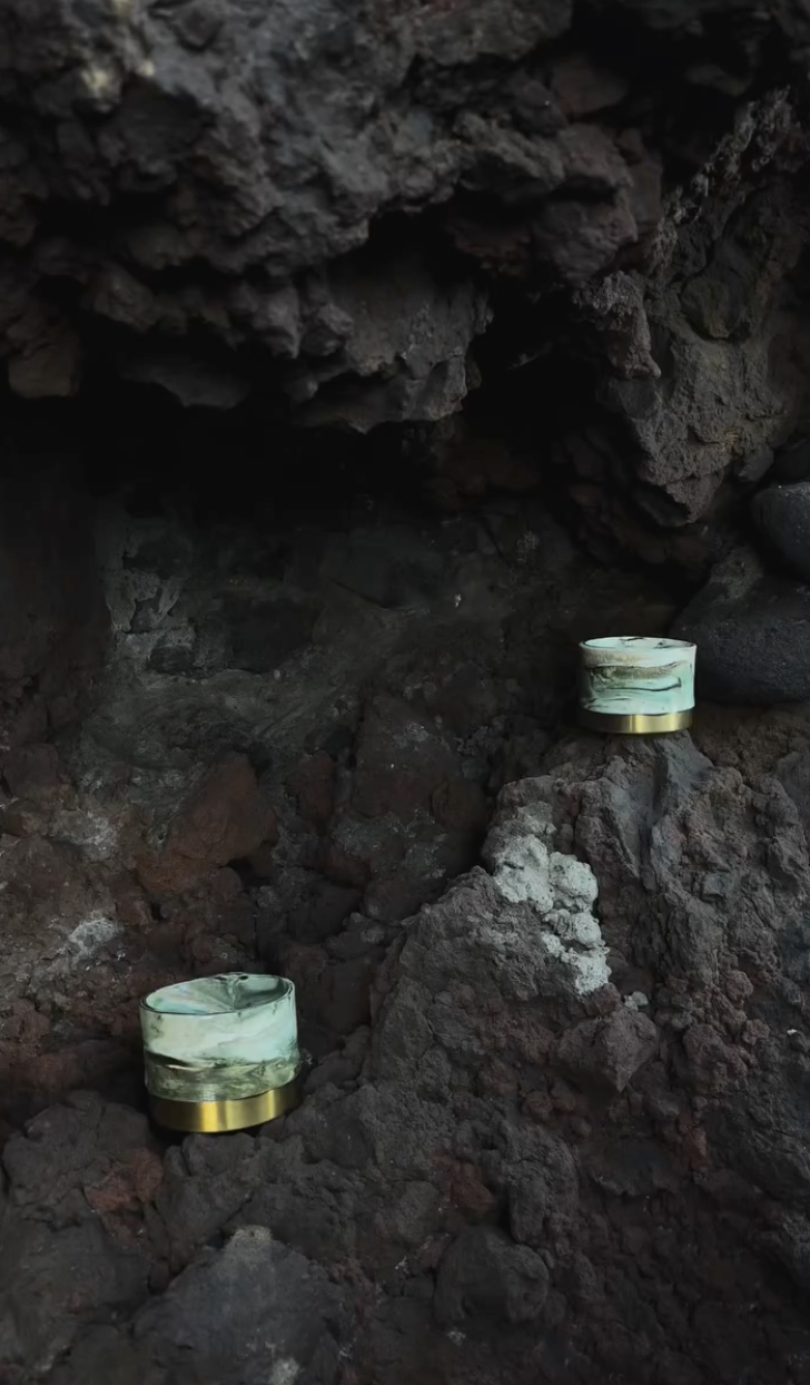 Panta Rei vase collection: two small marbled vessels on dark volcanic rock