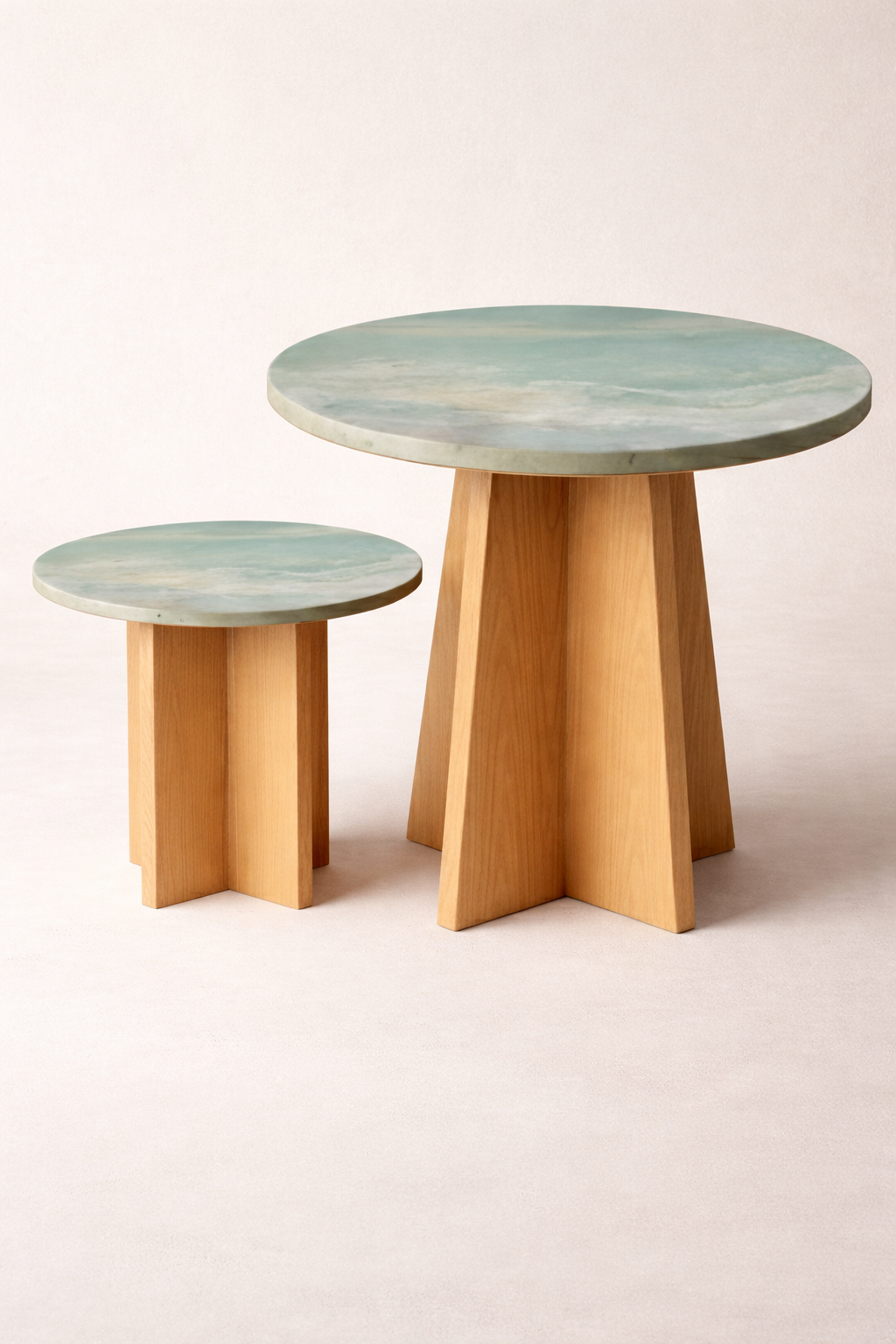 Panta Rei tables: pair of round tables with flowing green-grey ceramic tops on oak bases