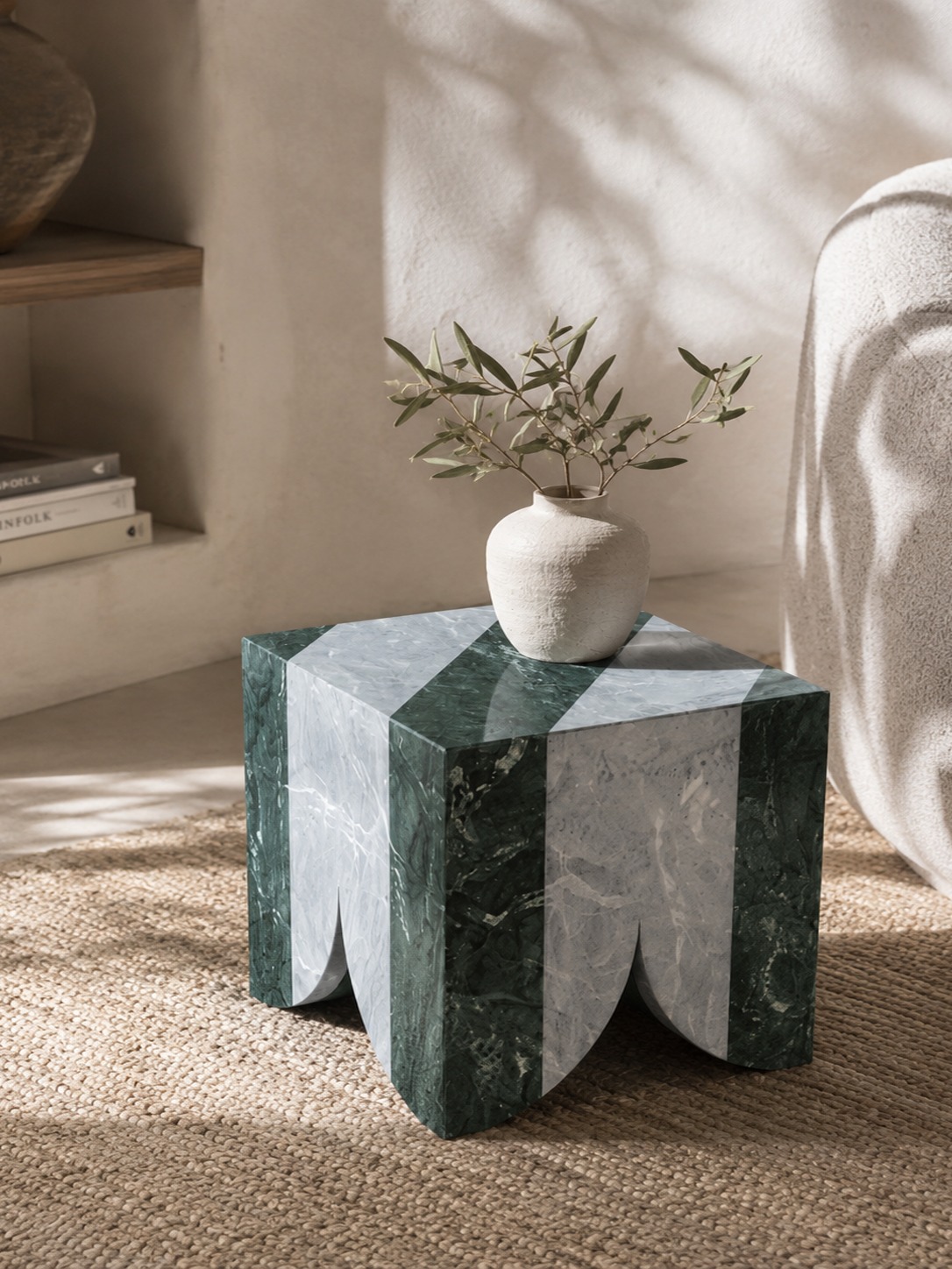 Atlas collection: green and white striped marble side table with a vase