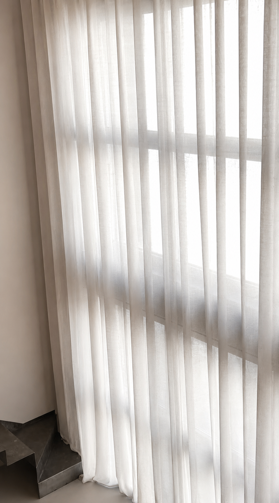 The Brutalist Grid: sheer curtains filtering daylight