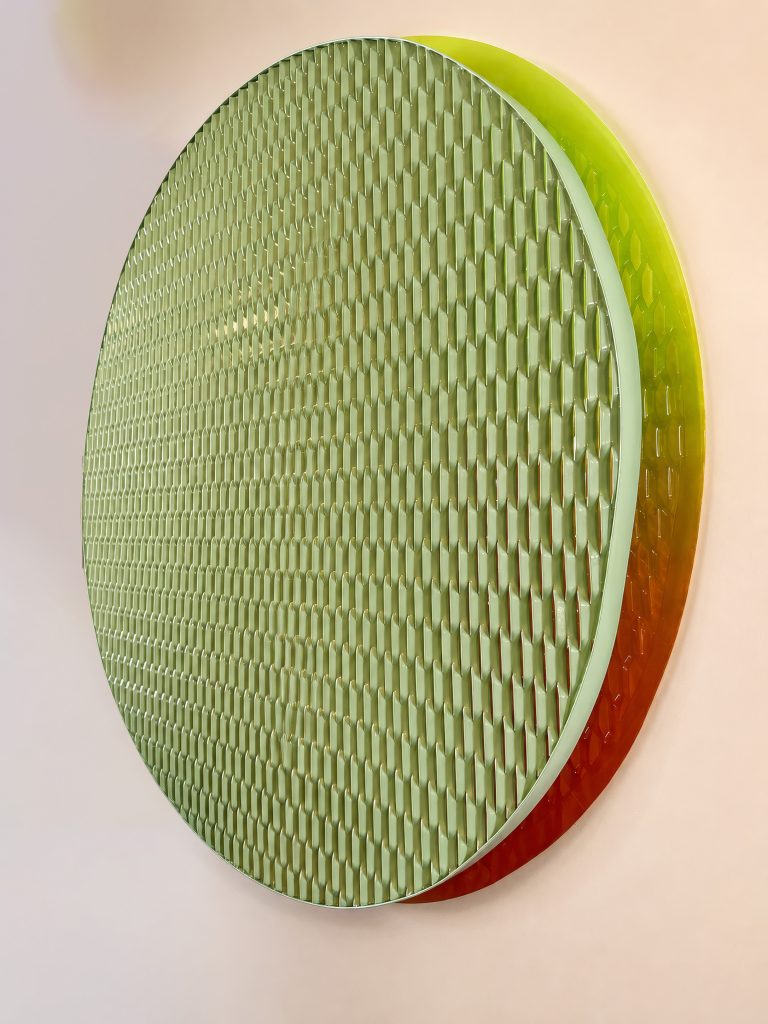 Peripheral Visions: circular expanded-metal panel with a green to yellow gradient