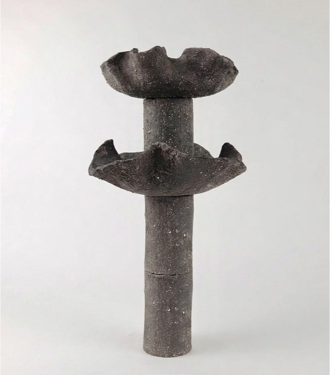 Delayed Matter by Elena Pelosi: grey ceramic column with two flared basins, the intermediate state after six months