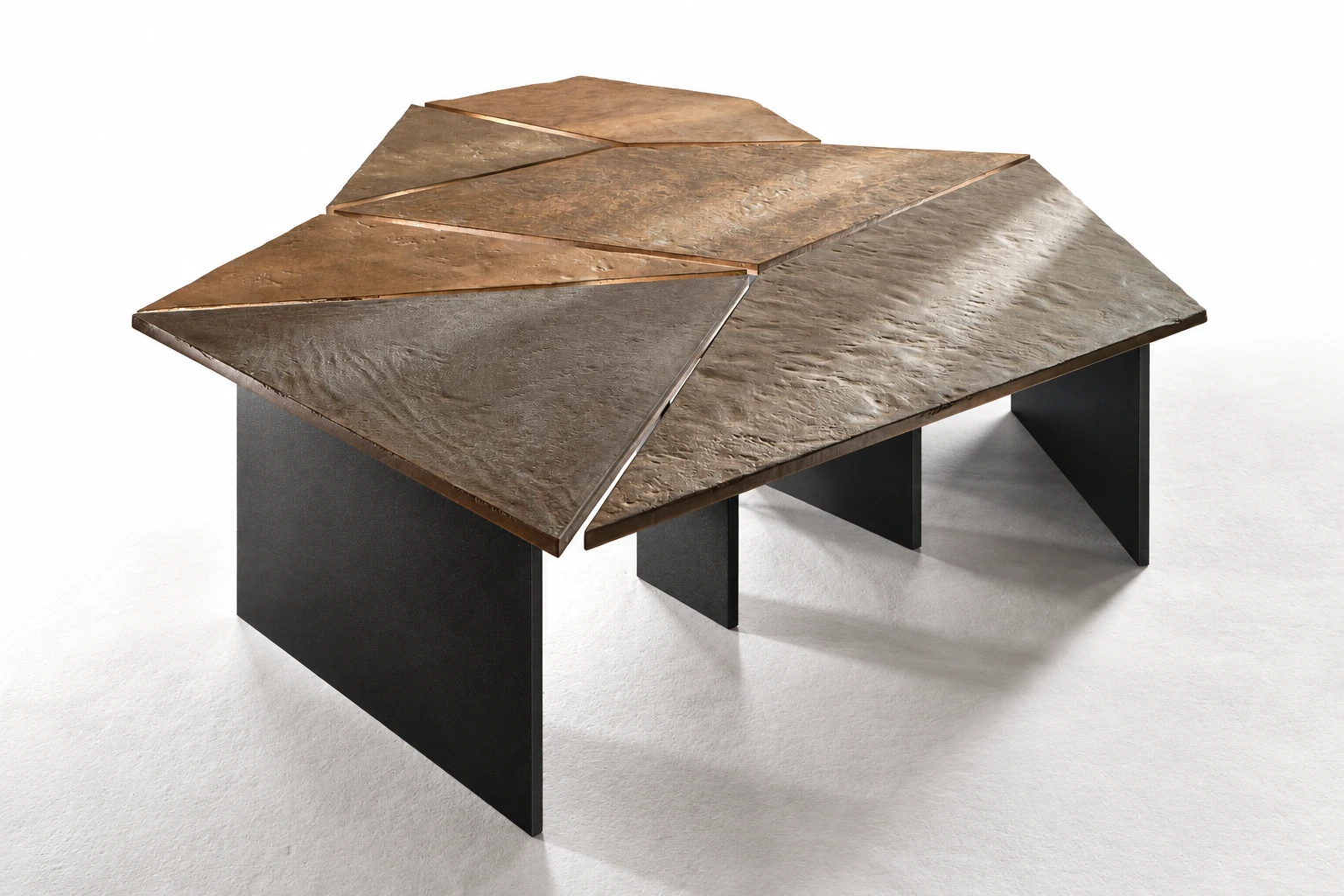 Three-quarter view of the six-piece Kurinuki coffee table with flat black metal plate bases.