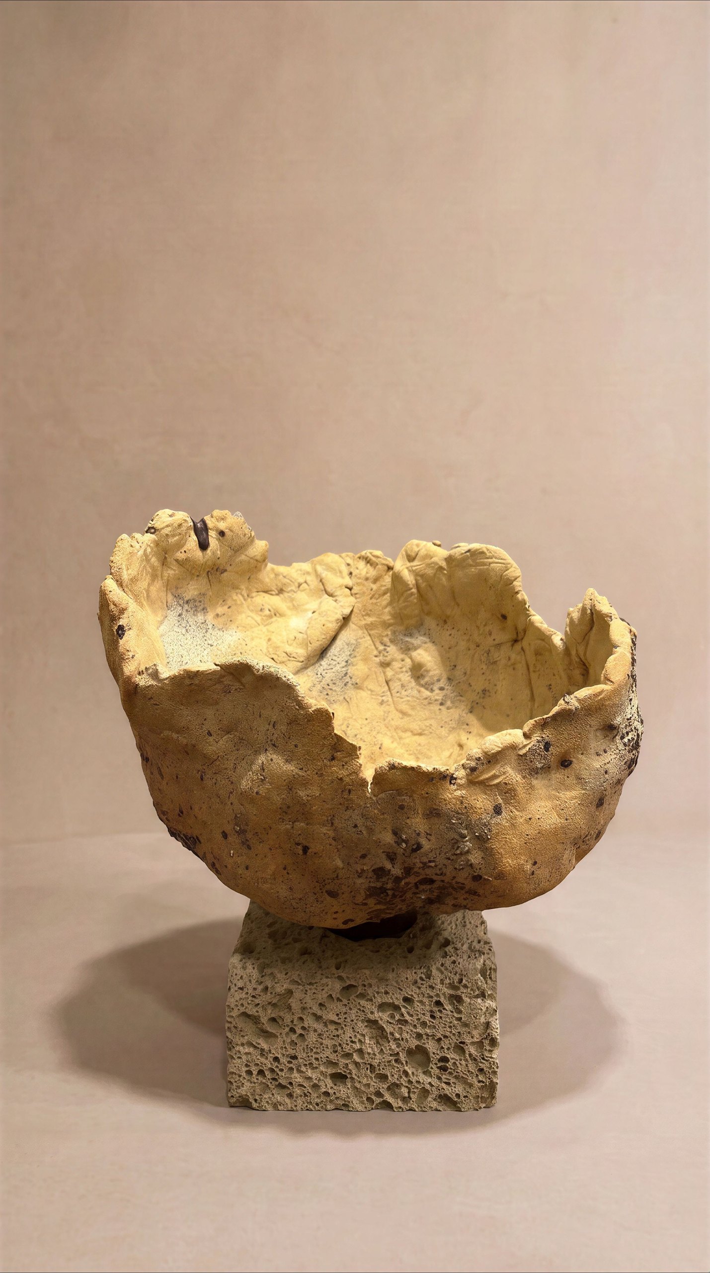 Urban Remains by Elena Pelosi: open ceramic bowl with an irregular rim on a reclaimed concrete block